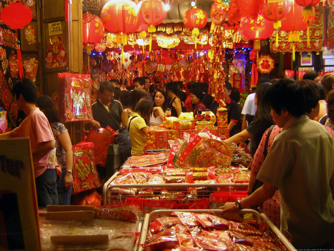 People looking at a market stall in China