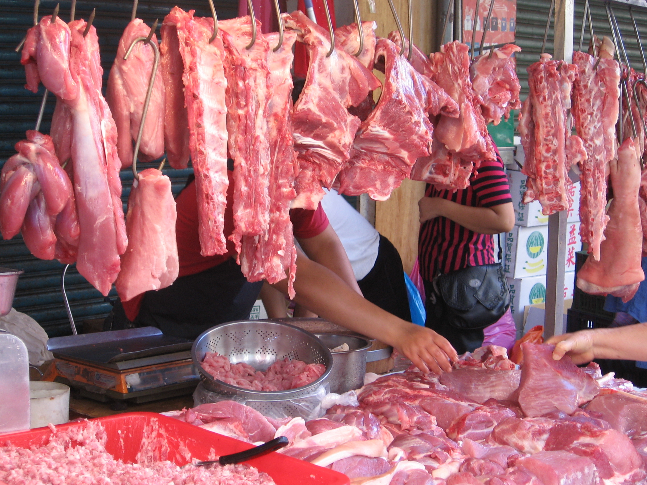 wet market selling pork in Asia