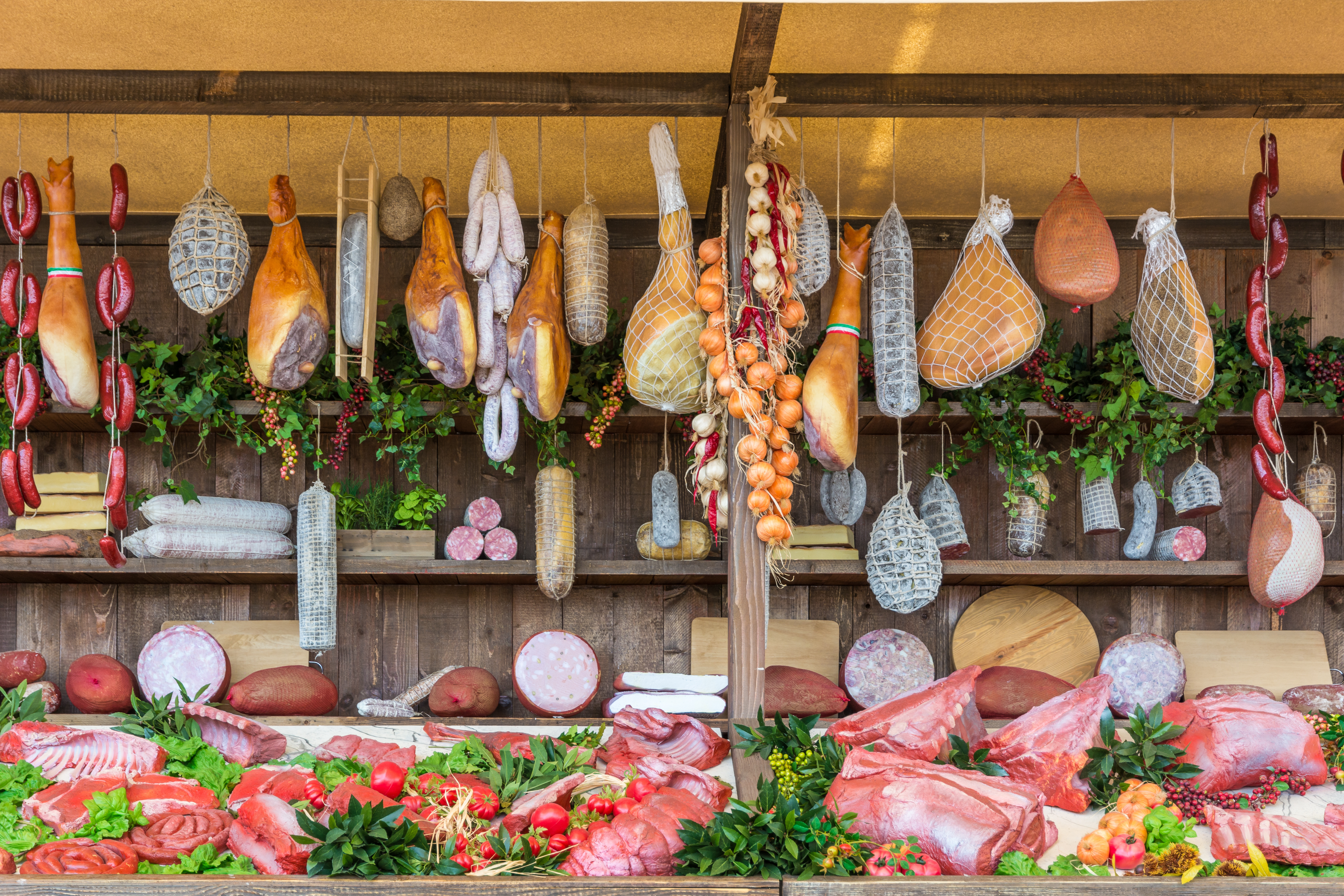Salami in a wooden market stall