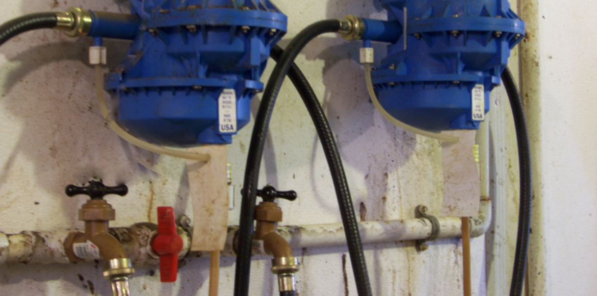 Hose bib connections and small diameter medicator supply lines reduce water flow.
