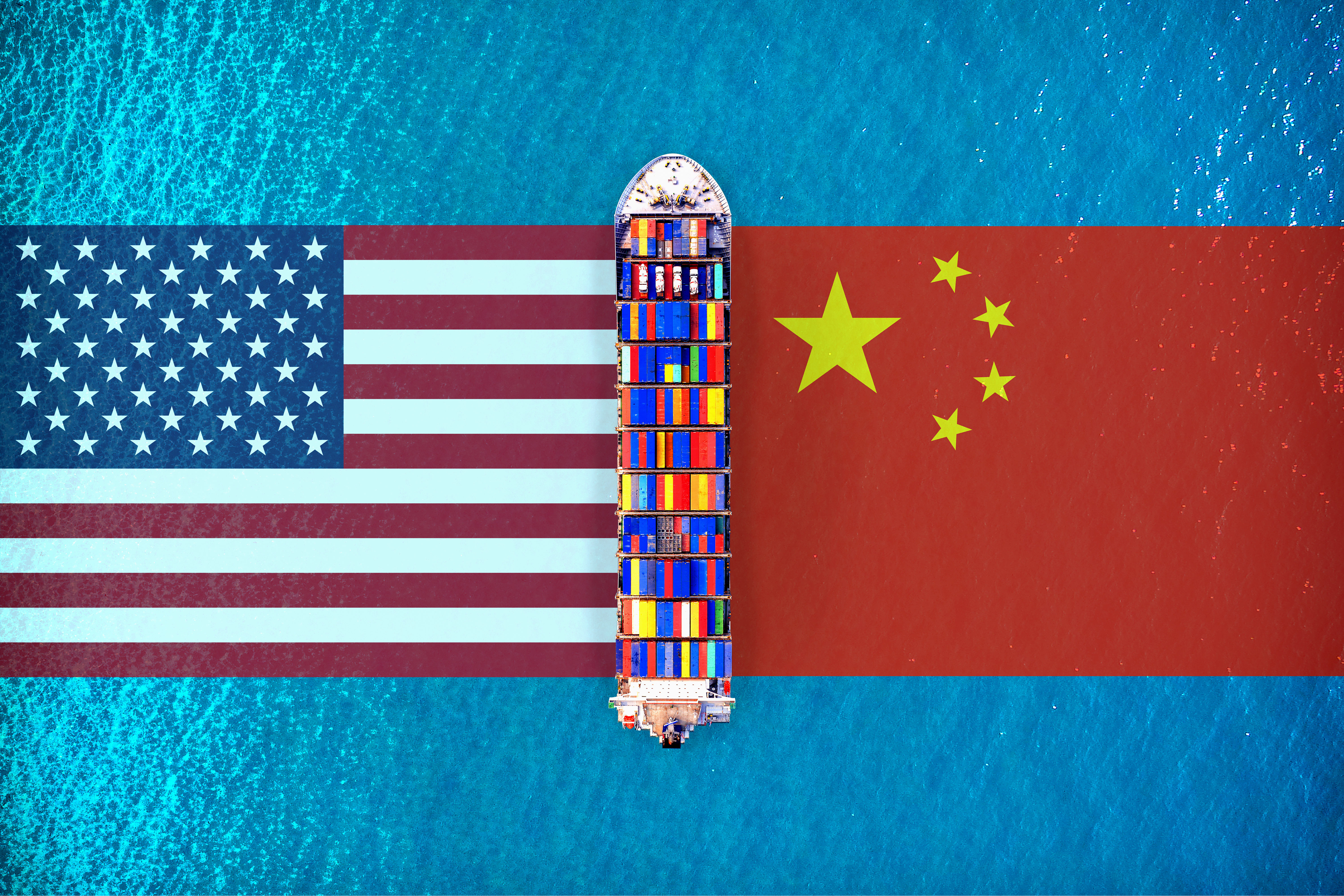 Overhead view of a container ship with the US and Chinese flags on either side