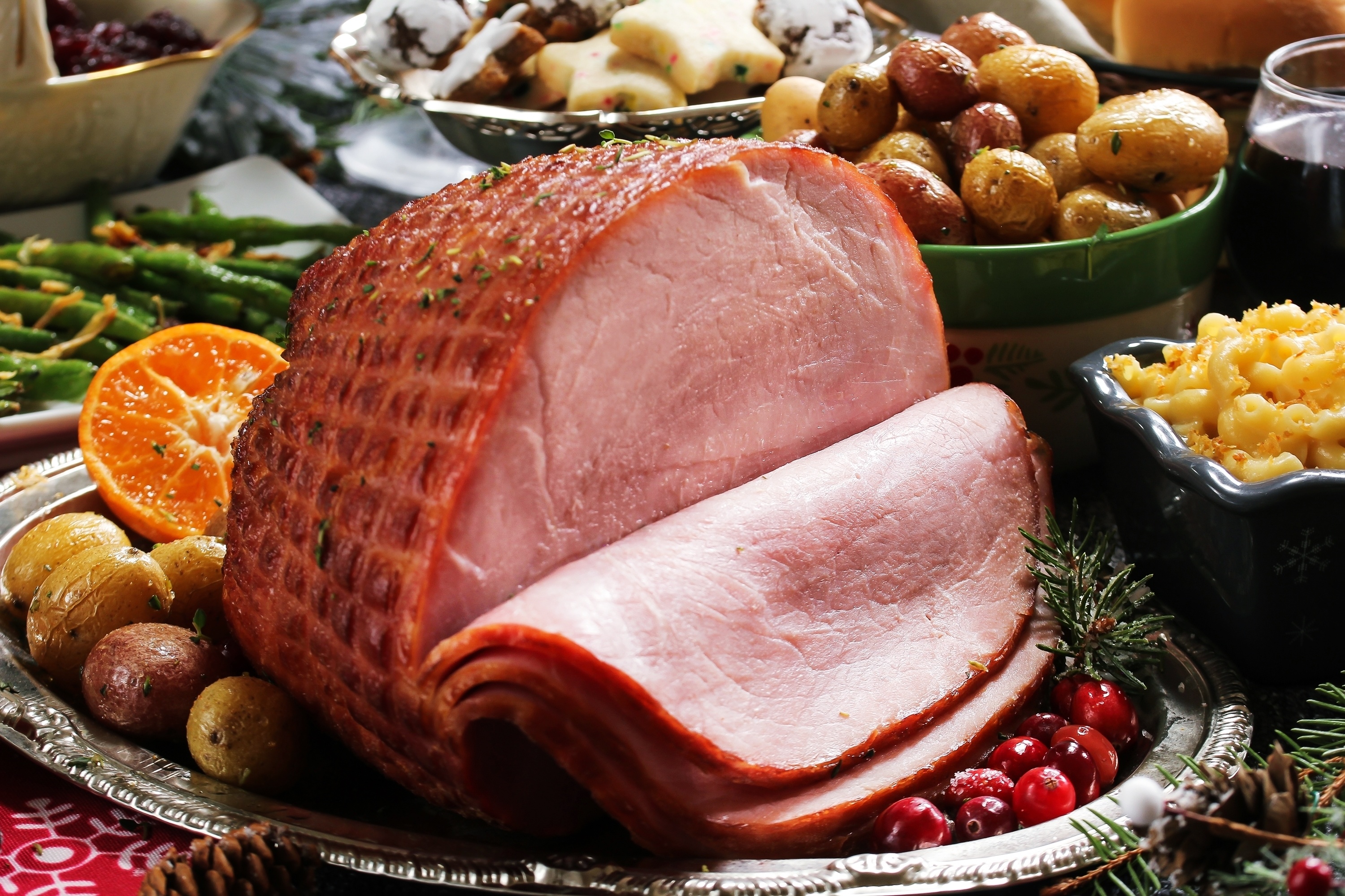 baked ham with cranberries potatoes and vegetables