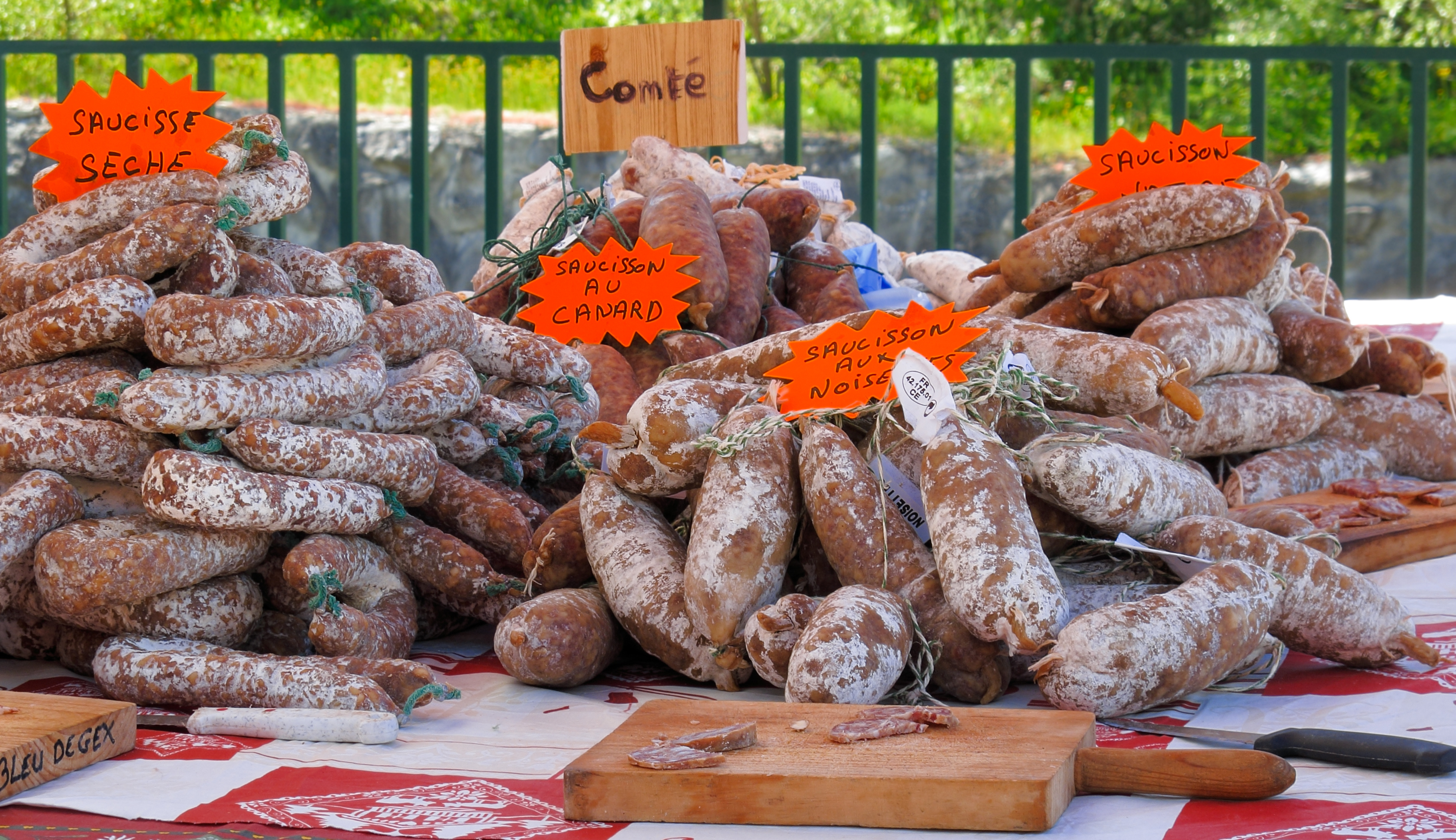 saucisse and charcuterie being sold at a market in France