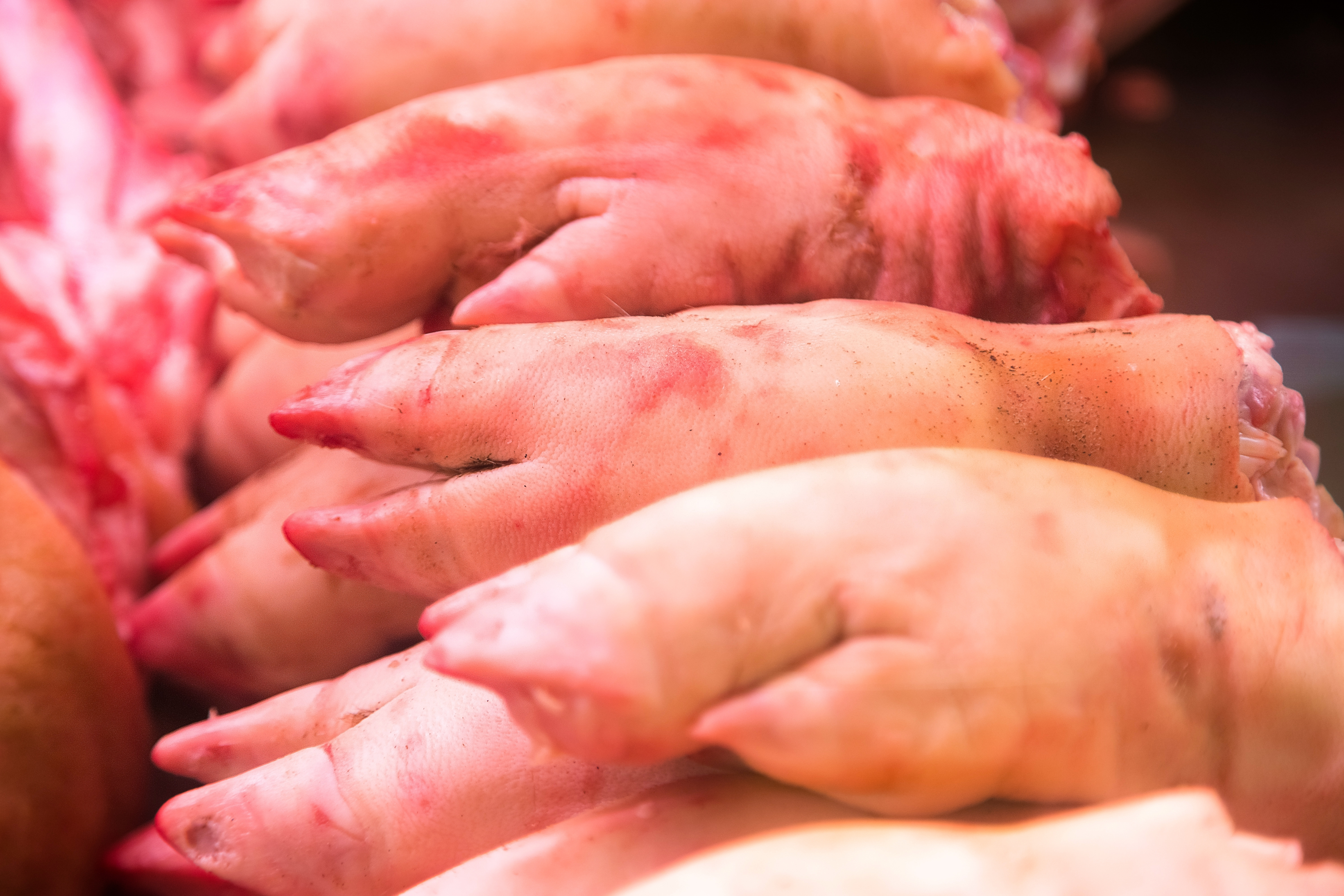 pig trotters for sale at a wet market