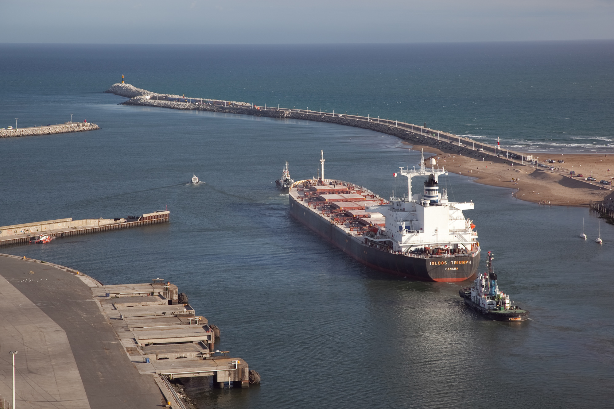 container ship sailing into a port