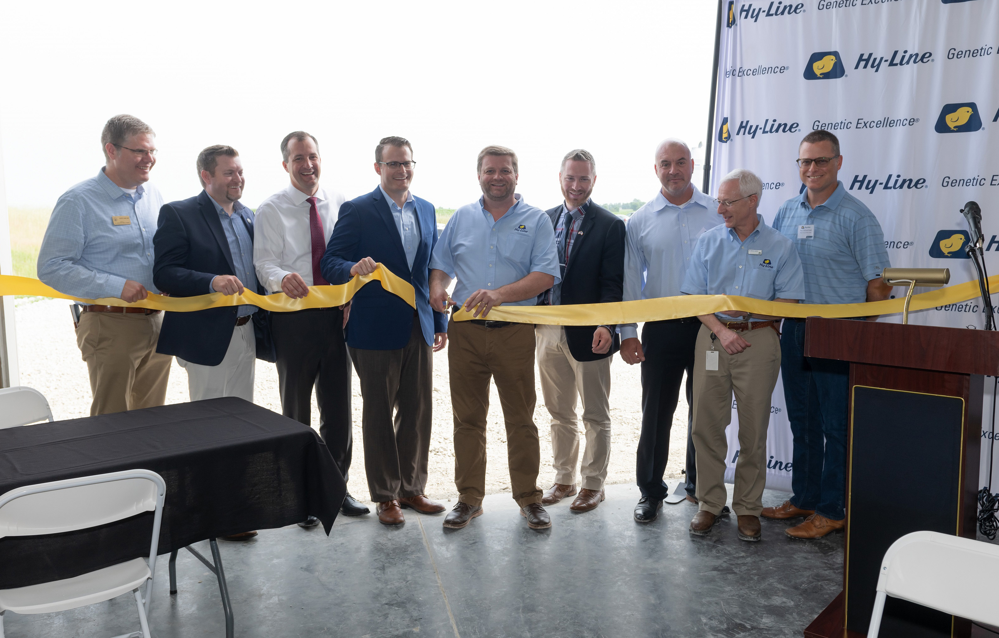 Hy-Line International President, Jonathan Cade (center), celebrates the opening of the Dr. Henry A. Wallace Farm with federal, state and local dignitaries and construction partners.