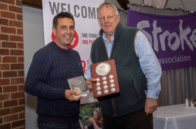 Peter Davidson, owner of C.E. DAVIDSON LTD., presents Nick Beavis of the Slate Hall team with the Steve Graham Top Gun trophy.