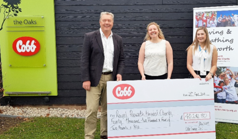 John Vincent, quality assurance director of Cobb Europe, presents Royal Papworth Hospital Charity with a cheque from funds raised at Cobb Europe Charity Clay Shoots over the last two years.