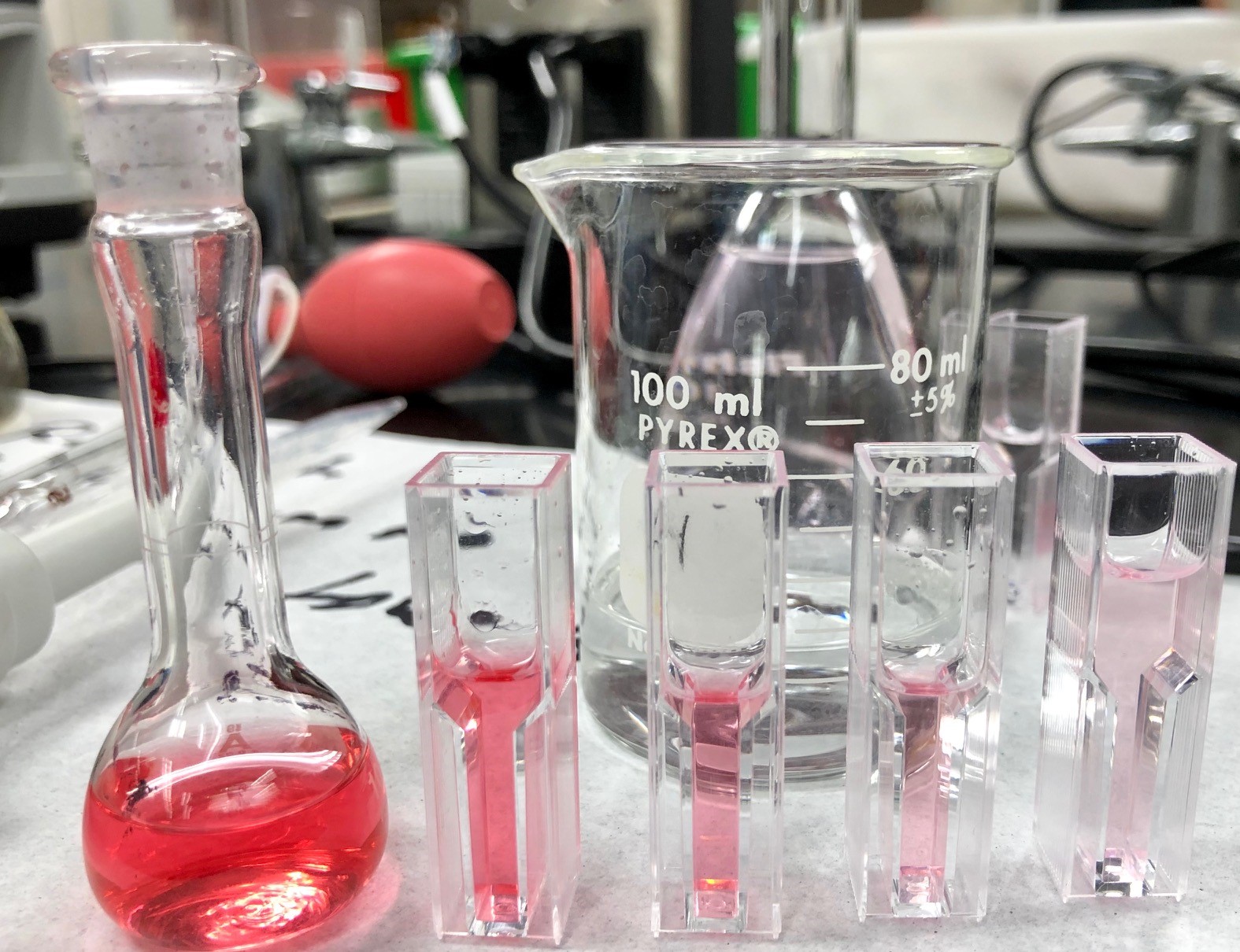 pink liquid in glass vials