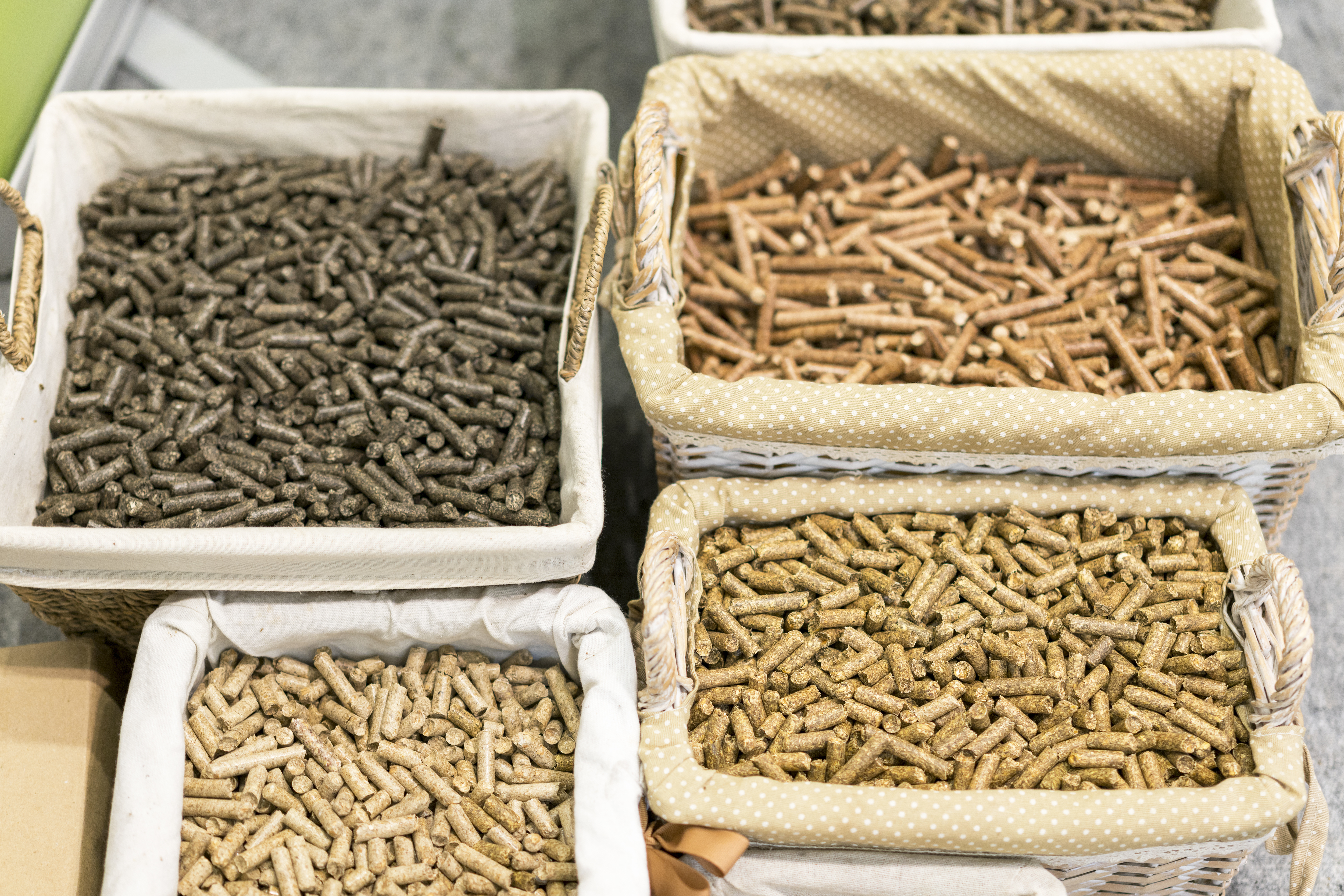 Wicker baskets holding different types of feed grains