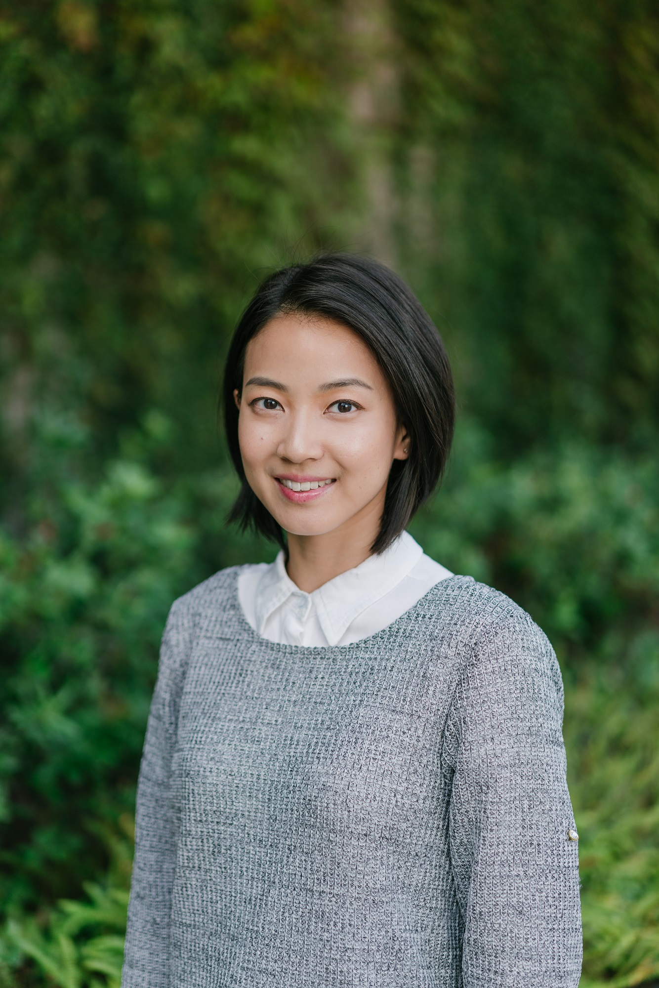 Katherine Ma standing in front of some trees