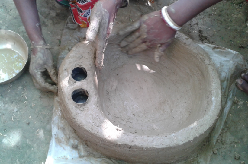 Sculpt the mixture into a round bowl shape, with two small holes on one side.