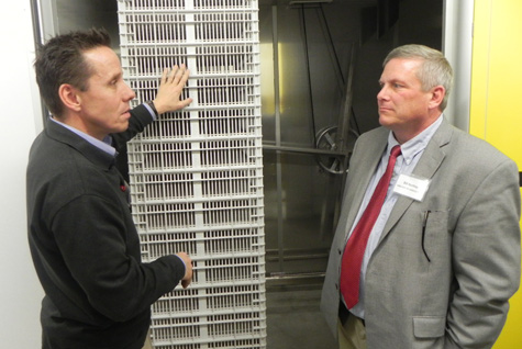 Bouke Hamminga from Pas Reform (left) explains the hatcher technology to Bill Northey, Iowa Secretary of Agriculture (right)